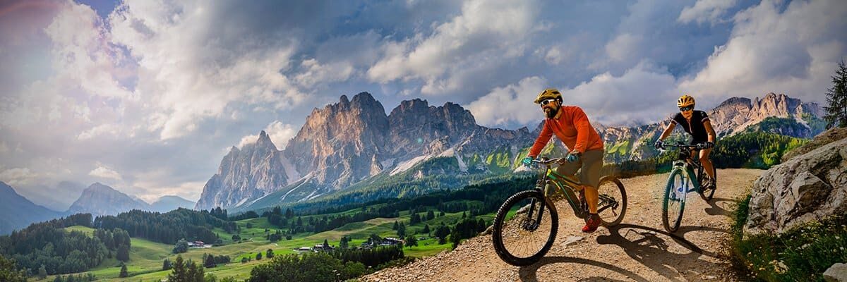 couple-cycling-in-mountains-2314641